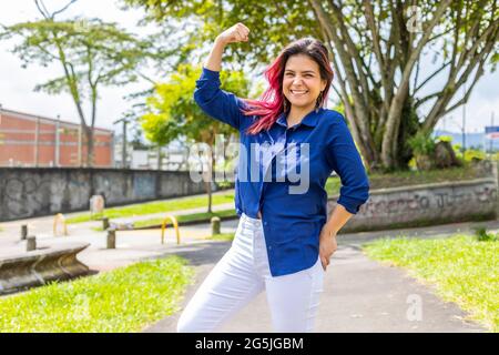 stylish young woman showing her fist and strength Stock Photo