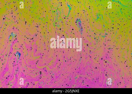 Fluid soap bubble psychedelic colorful abstract art. Surreal patterns with rainbows and waves of color in motion. Stock Photo