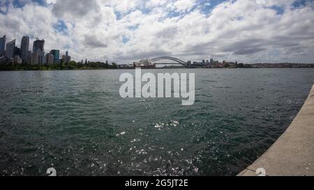 View of Sydney harbour and CDB on a beautiful sunny blue sky clear blue waters boats yachts and ferry residential and commercial buildings Australia Stock Photo