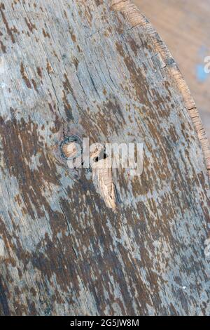 Close-up view. Old colorful rusty plywood material. Peeling paint on plywood. Old wooden material Stock Photo
