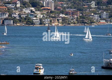 View of Sydney harbour and CDB on a beautiful sunny blue sky clear blue waters boats yachts and ferry residential and commercial buildings Australia Stock Photo