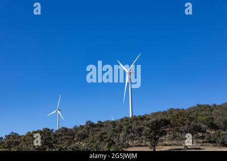 Electricity generating windmill Farms Hume Highway NSW Australia taken from moving car blurred foreground Stock Photo