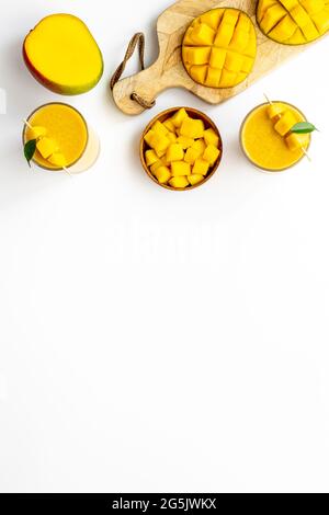 Top view of mango slices and cubes with fresh mango smoothie Stock Photo