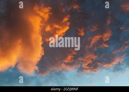 Dramatic clouds illuminated by sunset sun. Cloud background Stock Photo