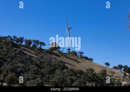 Electricity generating windmill Farms Hume Highway NSW Australia taken from moving car blurred foreground Stock Photo