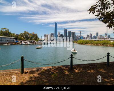 View of Sydney harbour and CDB on a beautiful sunny blue sky clear blue waters boats yachts and ferry residential and commercial buildings Australia Stock Photo