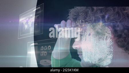 Composition of fingerprint and businessman with interactive screen with data processing Stock Photo