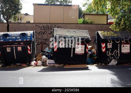 Rome, Italy. 28th June, 2021. Trash bins submerged by waste, in the eastern area of the city of Rome. For weeks, Rome has been experiencing the garbage emergency with a continuous rebound of responsibilities between the Municipality of Rome and the Lazio Region, while the doctors' association has warned against the risk of a hygienic crisis. (Photo by Vincenzo Nuzzolese/SOPA Images/Sipa USA) Credit: Sipa USA/Alamy Live News Stock Photo