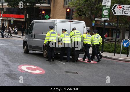 London, England, UK. 28th June, 2021. Police set up security line around Elephant and Castle station in South London as thick layer of smoke continues to rise. The cause and exact location of the fire remains unknown. Credit: Tayfun Salci/ZUMA Wire/Alamy Live News Stock Photo