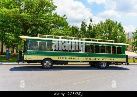 Hershey, PA, USA – June 27, 2021: The Hershey Trolley approaches Founders Hall at the Milton Hershey School. Stock Photo