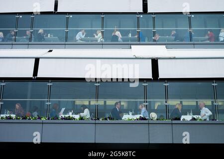 Wimbledon, London, UK. 28th June, 2021. People eat in one of the restaurants at the All England Club on day one of The Championships 2021, Wimbledon, South West London. Picture date: Monday June 28, 2021. Photo credit should read: Katie Collins/EMPICS/Alamy Credit: Katie Collins/Alamy Live News Stock Photo