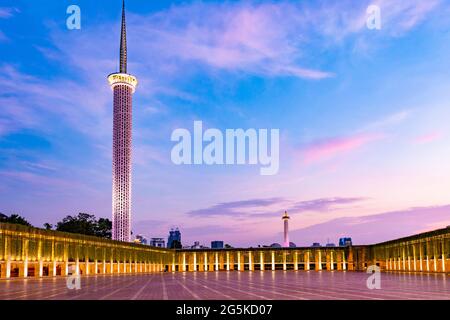 Jakarta, Indonesia - CIRCA June 2021: Minaret or tower of Istiqlal Mosque in Jakarta, Indonesia; with beautiful sunset sky Stock Photo