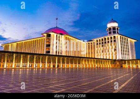Jakarta, Indonesia - CIRCA June 2021: Exterior of Istiqlal Mosque, Jakarta, Indonesia; at sunset or blue hour Stock Photo
