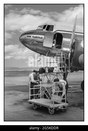 WW2 Commercial Flight 1940's Loading baggage on a DC3 plane at the municipal airport in Washington, D.C. America USA Jack Delano photographer 1941 July. United States--District of Columbia--Washington (D.C.) Stock Photo