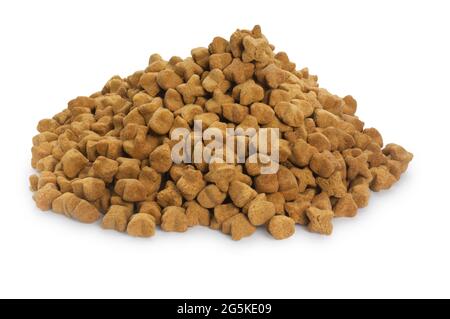 Studio shot of a pile of dried dog food cut out against a white background - John Gollop Stock Photo