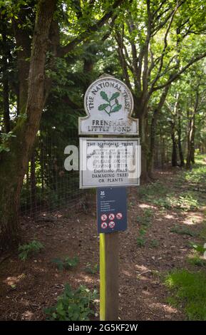 National Trust sign at Frensham Little Pond near Farnham, Surrey, south-east England, a popular outdoor beauty spot and recreational area Stock Photo