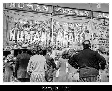 'Human Freak Show' non PC biological rarities Vintage' freak' show tent 1941 with 'freak show' illustration on side of a tent at the Rutland Fair in Rutland, Vermont.  a ‘freak show’ at the Rutland Fair,Vermont 1941 Sept. Jack Delano Photographer United States--Vermont--Rutland County--Rutland Stock Photo