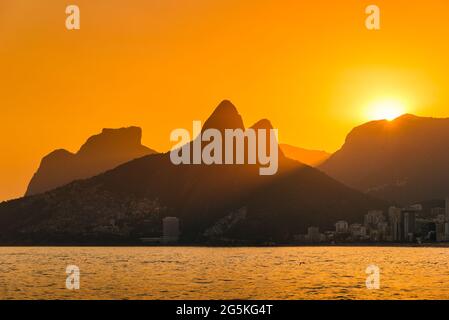 Sun Setting Behind Mountains of Rio de Janeiro Stock Photo