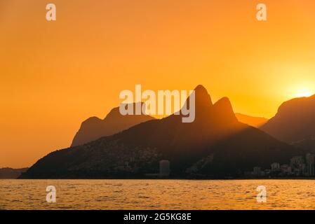 Sun Setting Behind Mountains of Rio de Janeiro Stock Photo