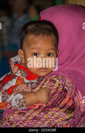 Young baby at local wedding in Medan Stock Photo