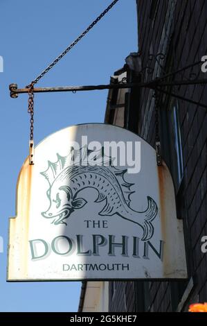 The pub sign hanging outside The Dolphin Inn in the Devon town of Dartmouth. Stock Photo