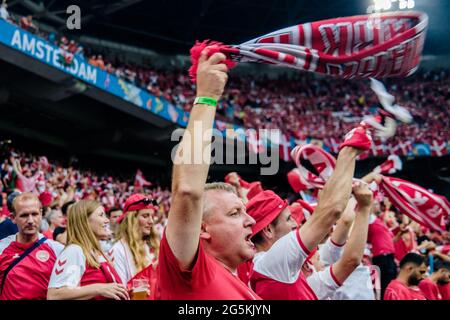Amsterdam, Netherlands. 26th, June 2021. Danish football fans dressed in red and white seen on Amsterdam Arena during the UEFA EURO 2020 match between Wales and Denmark in Amsterdam. (Photo credit: Gonzales Photo - Robert Hendel).