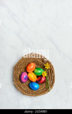 Colourful Easter eggs in Easter nest Stock Photo