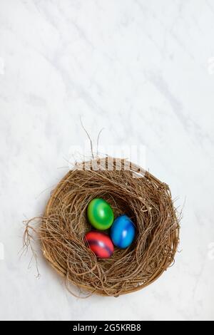 Colourful Easter eggs in Easter nest Stock Photo