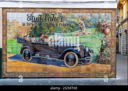 Old advertising Studebaker automobiles, painting from tiles with old car, Seville, Andalusia, Spain, Europe Stock Photo