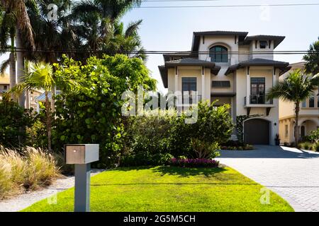 Bonita Springs, Florida gulf of mexico coast with mailbox at luxury villa mansion house modern waterfront architecture and driveway to garage Stock Photo