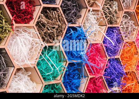 abstract multicolored hexagon patterned background with colored cut wrapping paper, abstract concept background Stock Photo