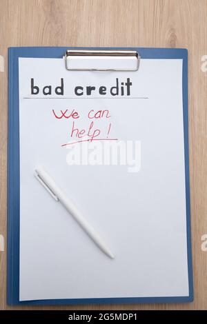 Shot of a "bad credit - we can help" text on a paper Stock Photo