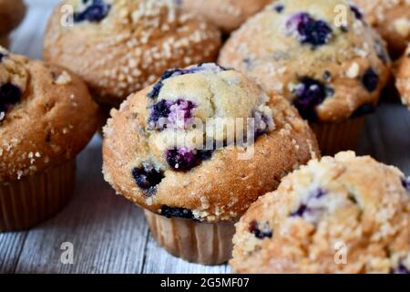 Blueberry muffins on a rustic wooden surface Stock Photo