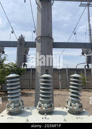 Closeup of electric insulators on a pole Stock Photo - Alamy