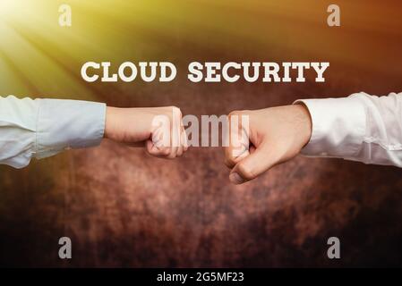 Text sign showing Cloud Security. Business idea Imposing a secured system of existing data in the Internet Two Professional Well-Dressed Corporate Stock Photo