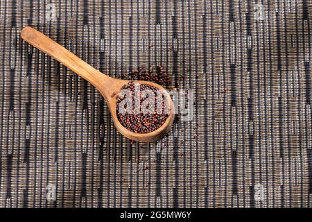 Brown mustard seeds in the spoon - healthy food Stock Photo