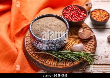 Board with different types of pepper on wooden background Stock Photo