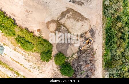 aerial view of an excavator in a landscape Stock Photo