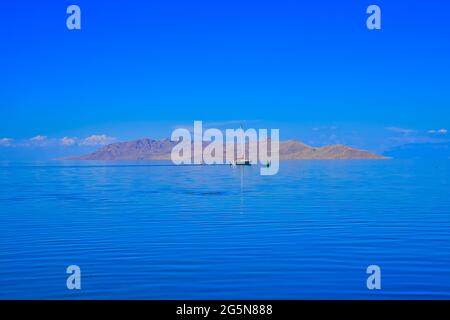Reflections of the sky reveal a blue lake surface, mysterious and serene. Salt Lake, fourth largest city in the Inland West, Utah, USA. 2016. Stock Photo