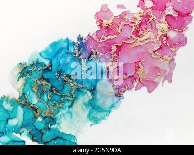 Alcohol ink fluid art. Waves in blue and pink colors with liquid golden inclusion. Abstract gradient background or texture Stock Photo