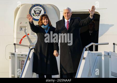 Feb 8, 2018-Songtan, South Korea-United States Vice President Mike Pence and Karen Pence arrives at Osan military air base in Songtan, South Korea.  Vice President Mike Pence is pushing South Korea to adopt a more hawkish stance toward the North, as he arrived in the country Thursday ahead of the Winter Olympics. Pence met with President Moon Jae-in to advocate a clear-eyed approach toward his bellicose, nuclear-armed neighbor, warning against North Korean 'propaganda' around the games. Athletes from both Koreas will compete as one team in the games opening Friday that senior officials from th Stock Photo