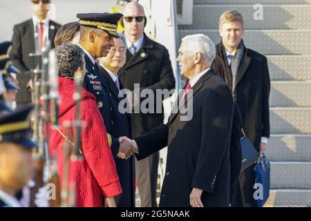 Feb 8, 2018-Songtan, South Korea-United States Vice President Mike Pence and Vincent Brooks USFK Commander shakes hands after arrives at Osan military air base in Songtan, South Korea.  Vice President Mike Pence is pushing South Korea to adopt a more hawkish stance toward the North, as he arrived in the country Thursday ahead of the Winter Olympics. Pence met with President Moon Jae-in to advocate a clear-eyed approach toward his bellicose, nuclear-armed neighbor, warning against North Korean 'propaganda' around the games. Athletes from both Koreas will compete as one team in the games opening Stock Photo