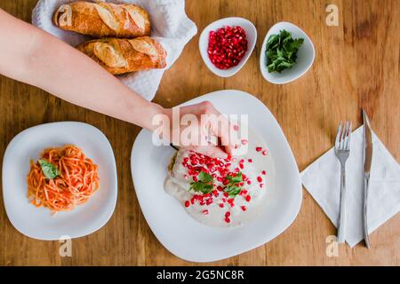 Chile en nogada hands cooking mexican food traditional from Puebla Mexico Stock Photo