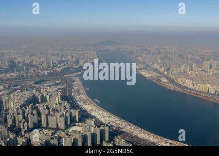 Daylight scene of Seoul, view from Lotte World Tower top. Lotte World Tower is a 123-floor, 554.5-metre (1,819 ft) supertall skyscraper that finished external construction on March 17, 2016. The building's final 123rd floor was topped out on December 22, 2015. It is currently the tallest building in the OECD, and is the 5th tallest building in the world. Stock Photo