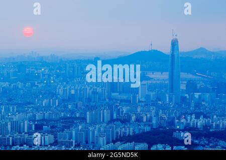 Daylight scene of Lotte World Tower, view from Namhan Sanseong castle. Lotte World Tower is a 123-floor, 554.5-metre (1,819 ft) supertall skyscraper that finished external construction on March 17, 2016. The building's final 123rd floor was topped out on December 22, 2015. It is currently the tallest building in the OECD, and is the 5th tallest building in the world. Stock Photo