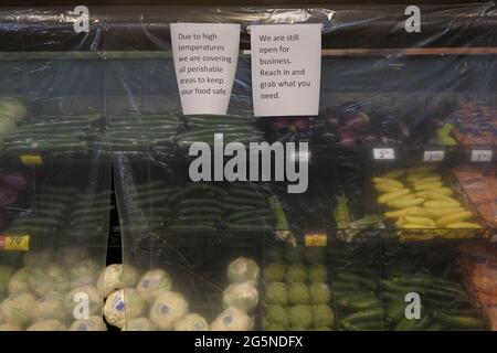 Portland, USA. 28th June, 2021. Perishable items are covered with a layer of plastic to keep in the cool air at a Fred Meyer grocery store in Portland, Ore., on June 28, 2021, where temperatures reached an all time high of 116 degrees Fahrenheit. (Photo by Alex Milan Tracy/Sipa USA) Credit: Sipa USA/Alamy Live News Stock Photo