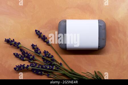 Lavender soap with unlabeled white banderole with fresh lavender flowers Stock Photo