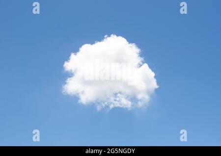 Single white cloud stay alone in bright blue sky in summertime. Stock Photo