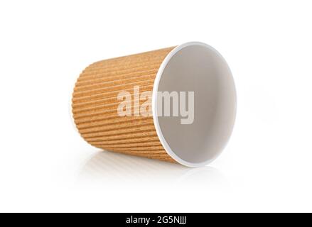 a paper coffee cup sits on a white table Stock Photo