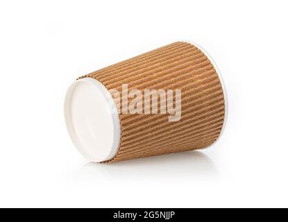 a paper coffee cup sits on a white table Stock Photo